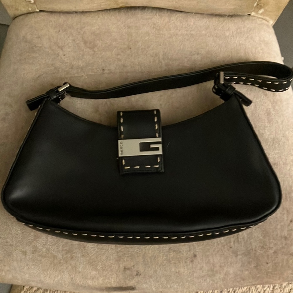 Guess small faux leather hand bag.  Black perfect condition thx